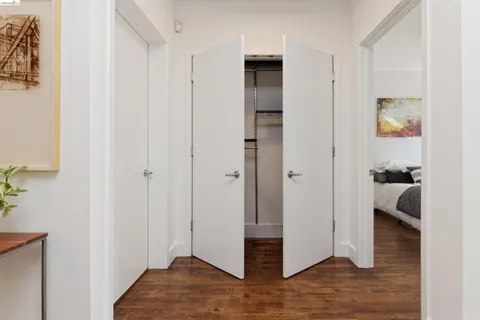 a view of livingroom with hardwood floor and a hallway