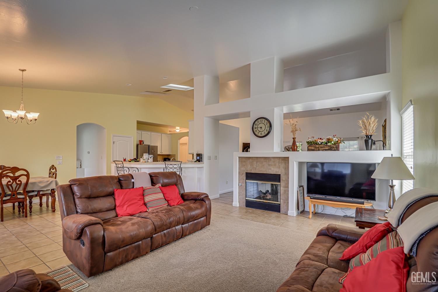 Undisclosed Address Bakersfield, CA 93311 - Photo 11 of 31 a living room with furniture and a fireplace