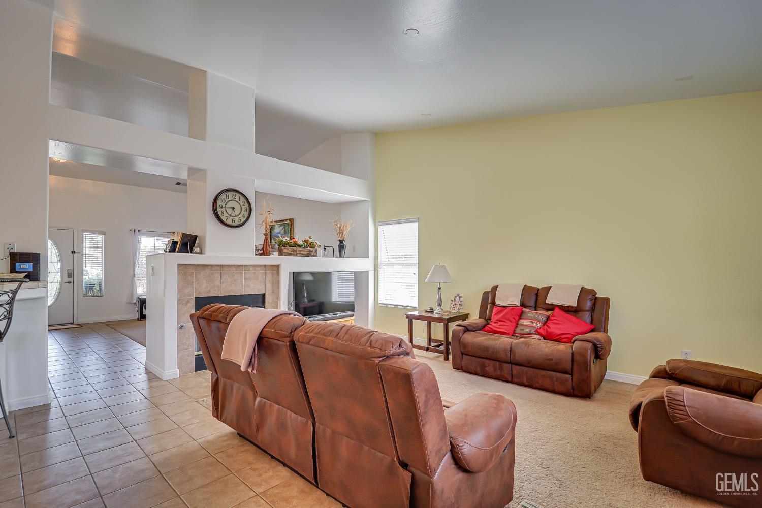 Undisclosed Address Bakersfield, CA 93311 - Photo 12 of 31 a living room with furniture and a fireplace