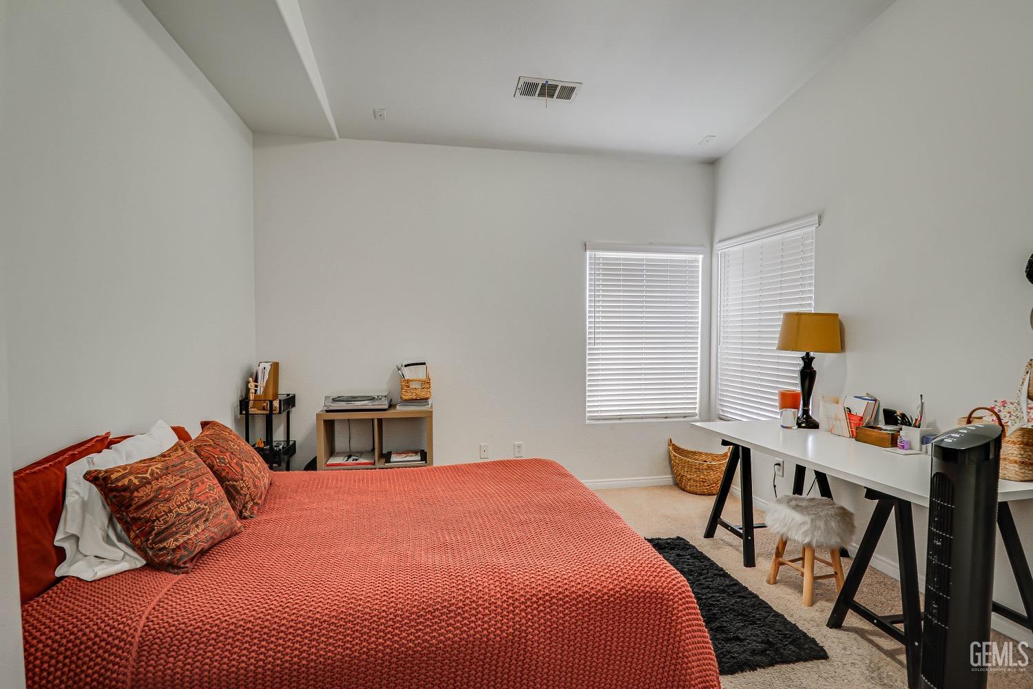 Undisclosed Address Bakersfield, CA 93311 - Photo 18 of 31 a bedroom with a bed and a table in it