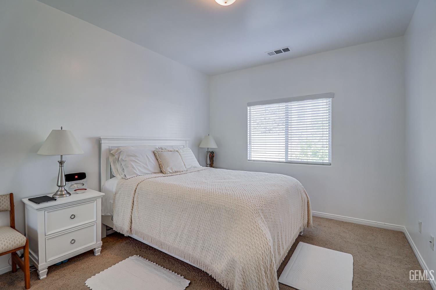 Undisclosed Address Bakersfield, CA 93311 - Photo 20 of 31 a bedroom with a bed and a window