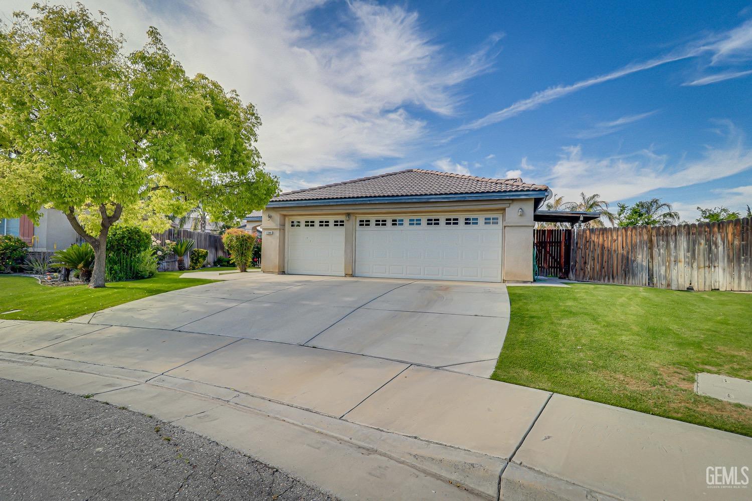 Undisclosed Address Bakersfield, CA 93311 - Photo 2 of 31 a view of backyard of house with green space