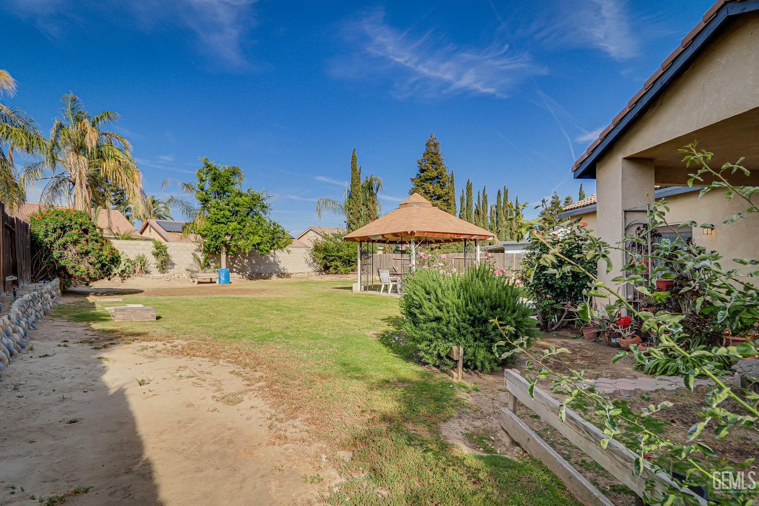 Undisclosed Address Bakersfield, CA 93311 - Photo 29 of 31 a front view of a house with garden