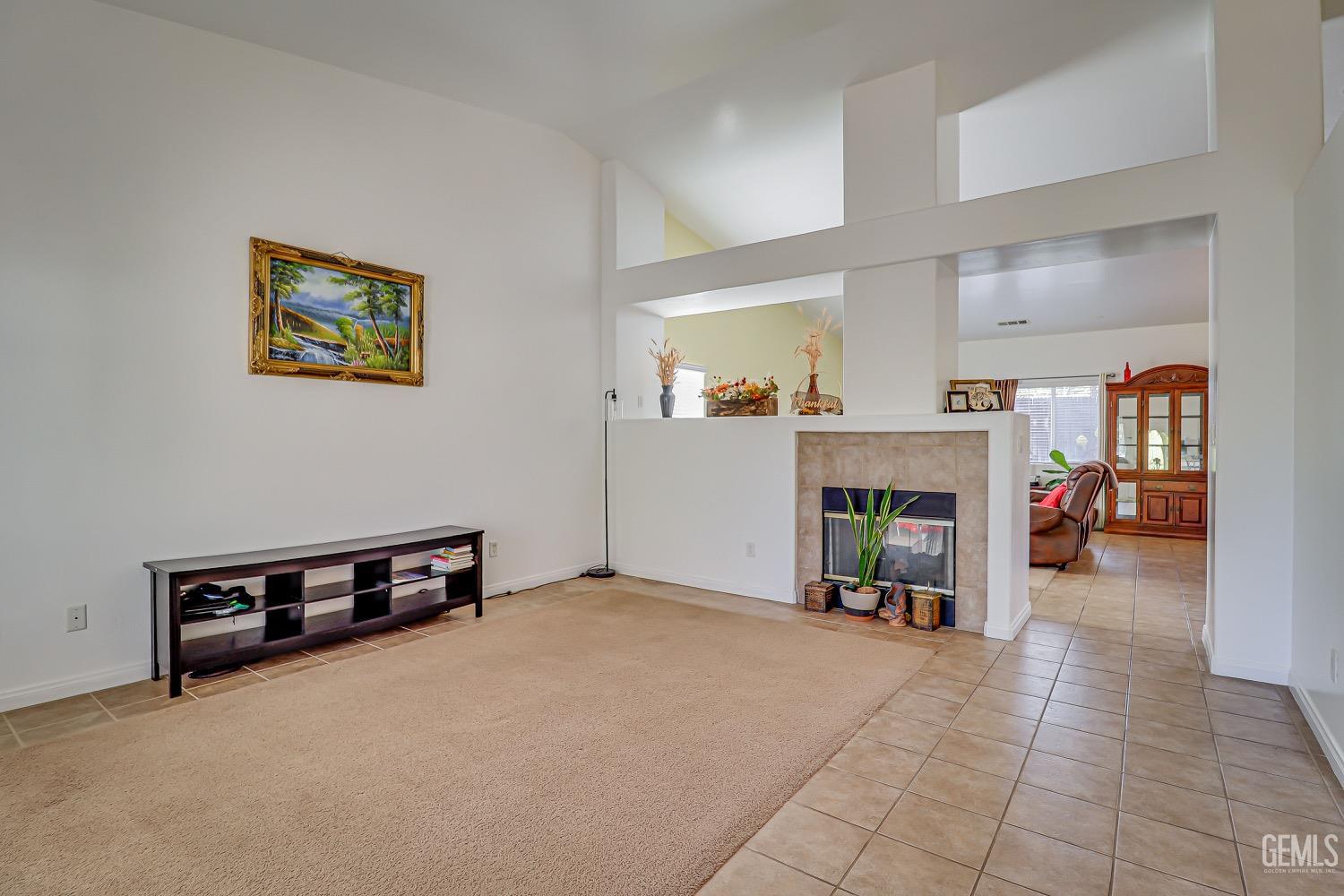 Undisclosed Address Bakersfield, CA 93311 - Photo 5 of 31 a living room with furniture and a fireplace
