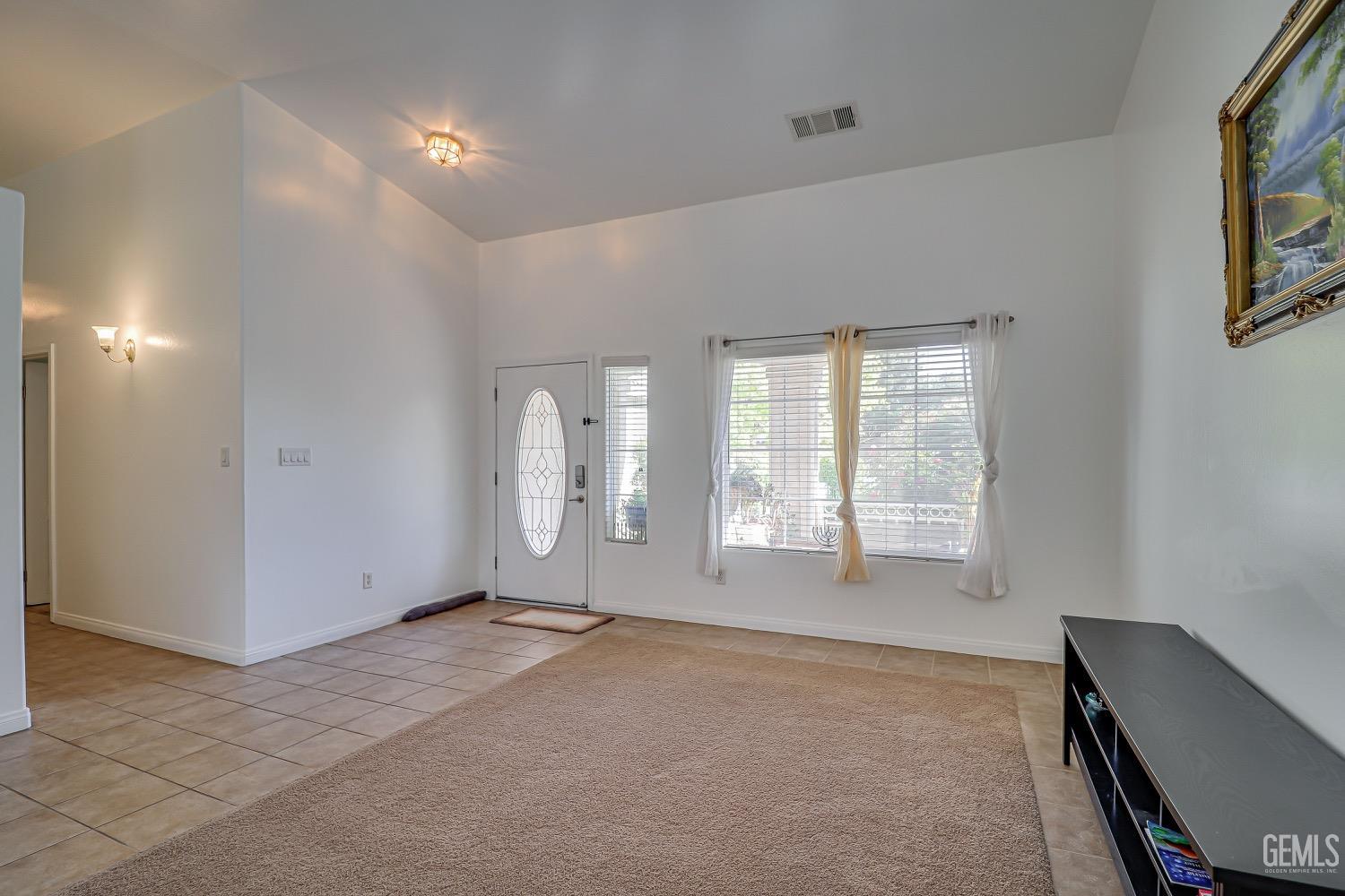 Undisclosed Address Bakersfield, CA 93311 - Photo 8 of 31 a view of an empty room with a window