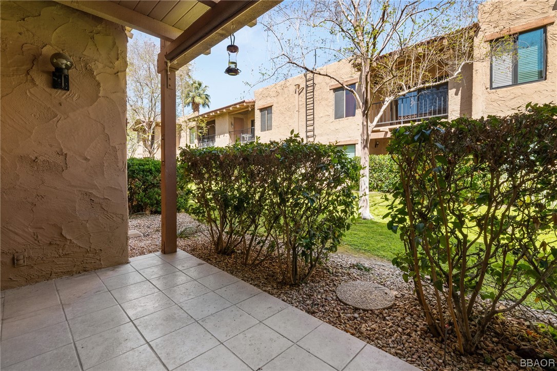 1050 Ramon Road, Unit 8 Palm Springs, CA 92264 - Photo 16 of 31 a view of a pathway along with potted plants