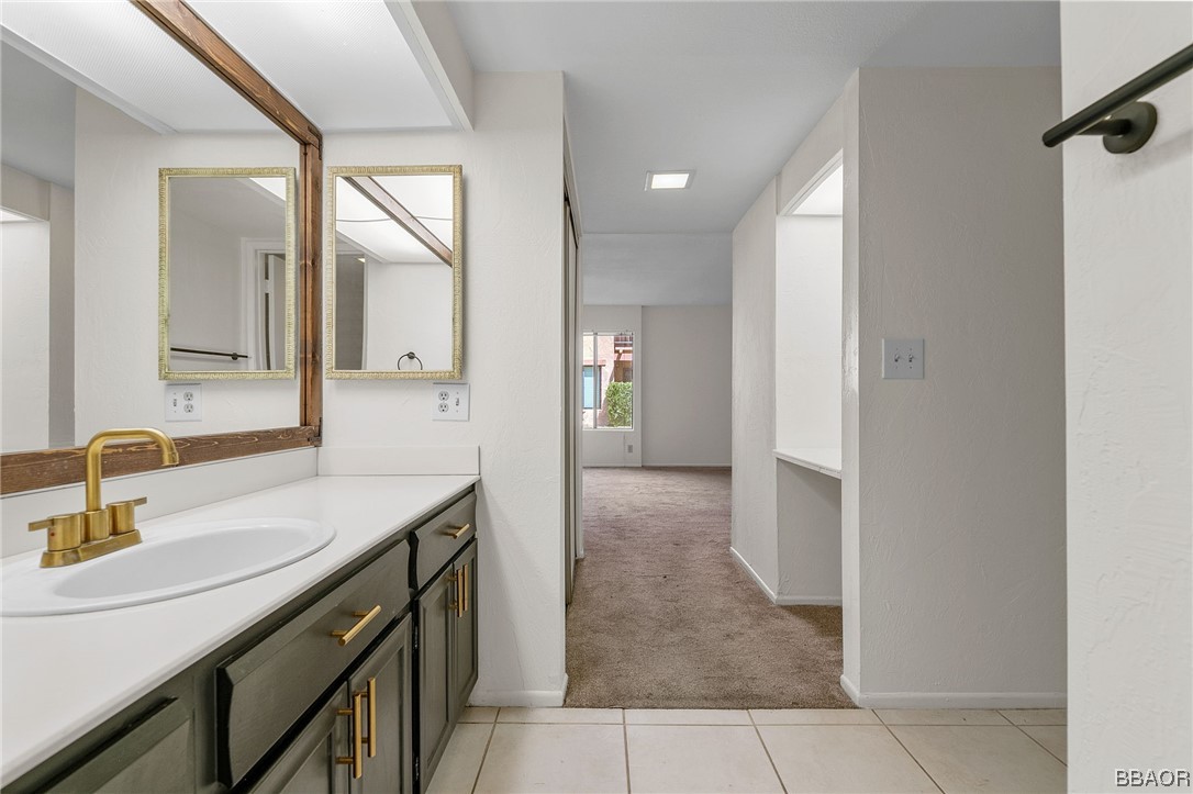 1050 Ramon Road, Unit 8 Palm Springs, CA 92264 - Photo 20 of 31 a bathroom with a sink and a mirror