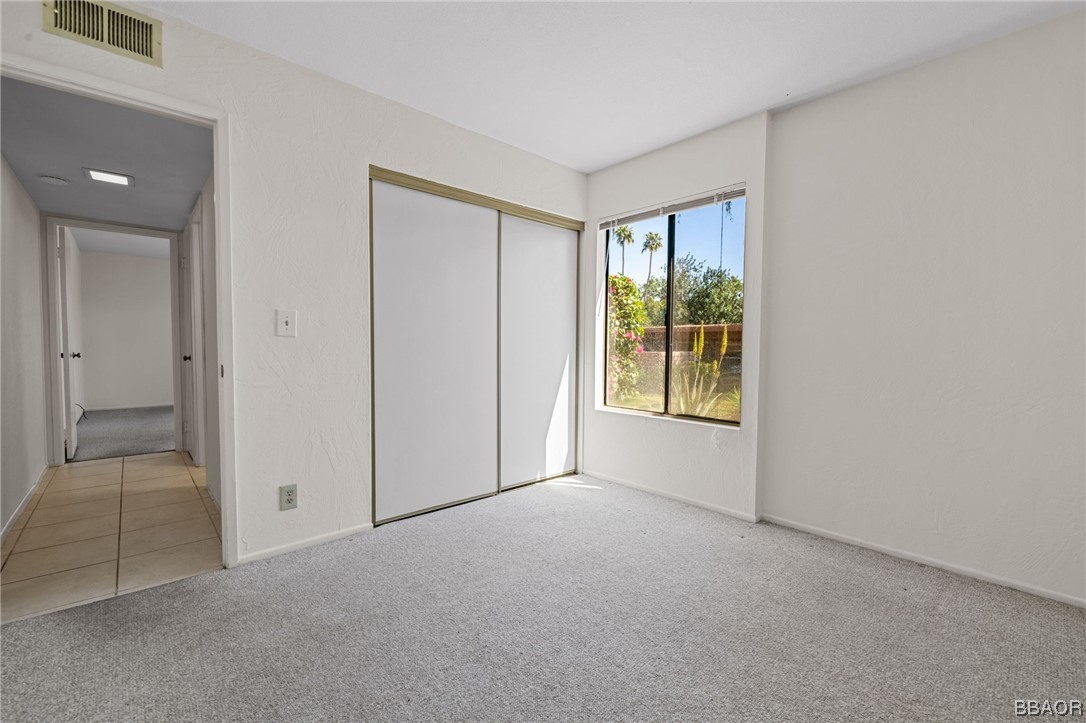 1050 Ramon Road, Unit 8 Palm Springs, CA 92264 - Photo 27 of 31 a view of an empty room with a window
