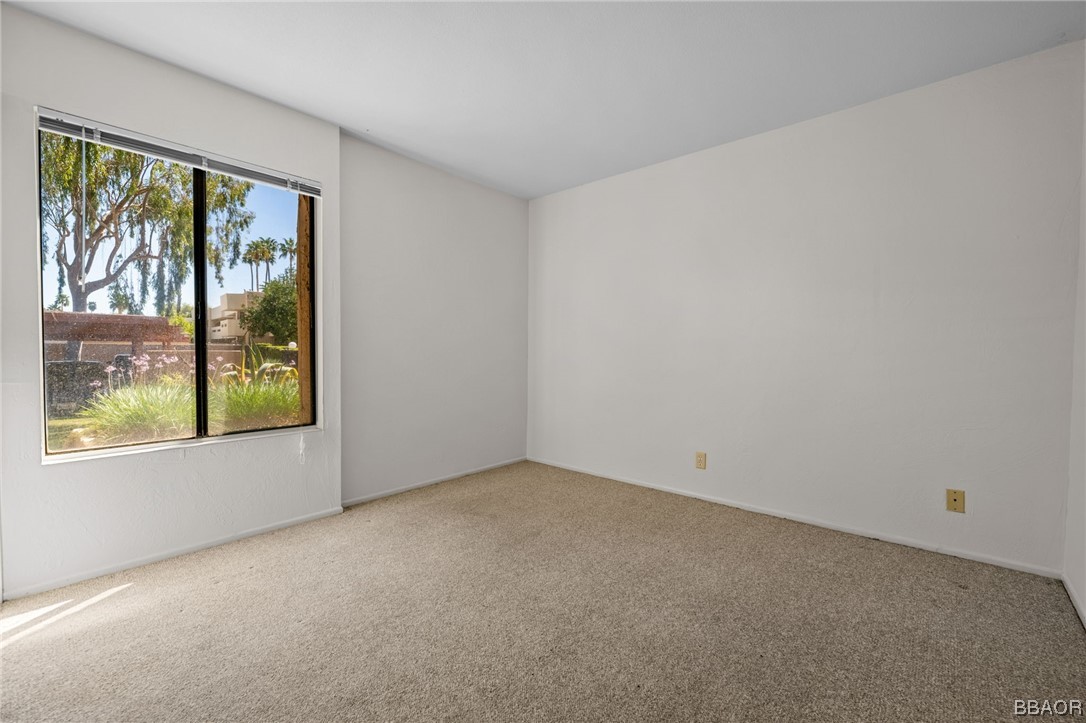 1050 Ramon Road, Unit 8 Palm Springs, CA 92264 - Photo 28 of 31 a view of a big room with window