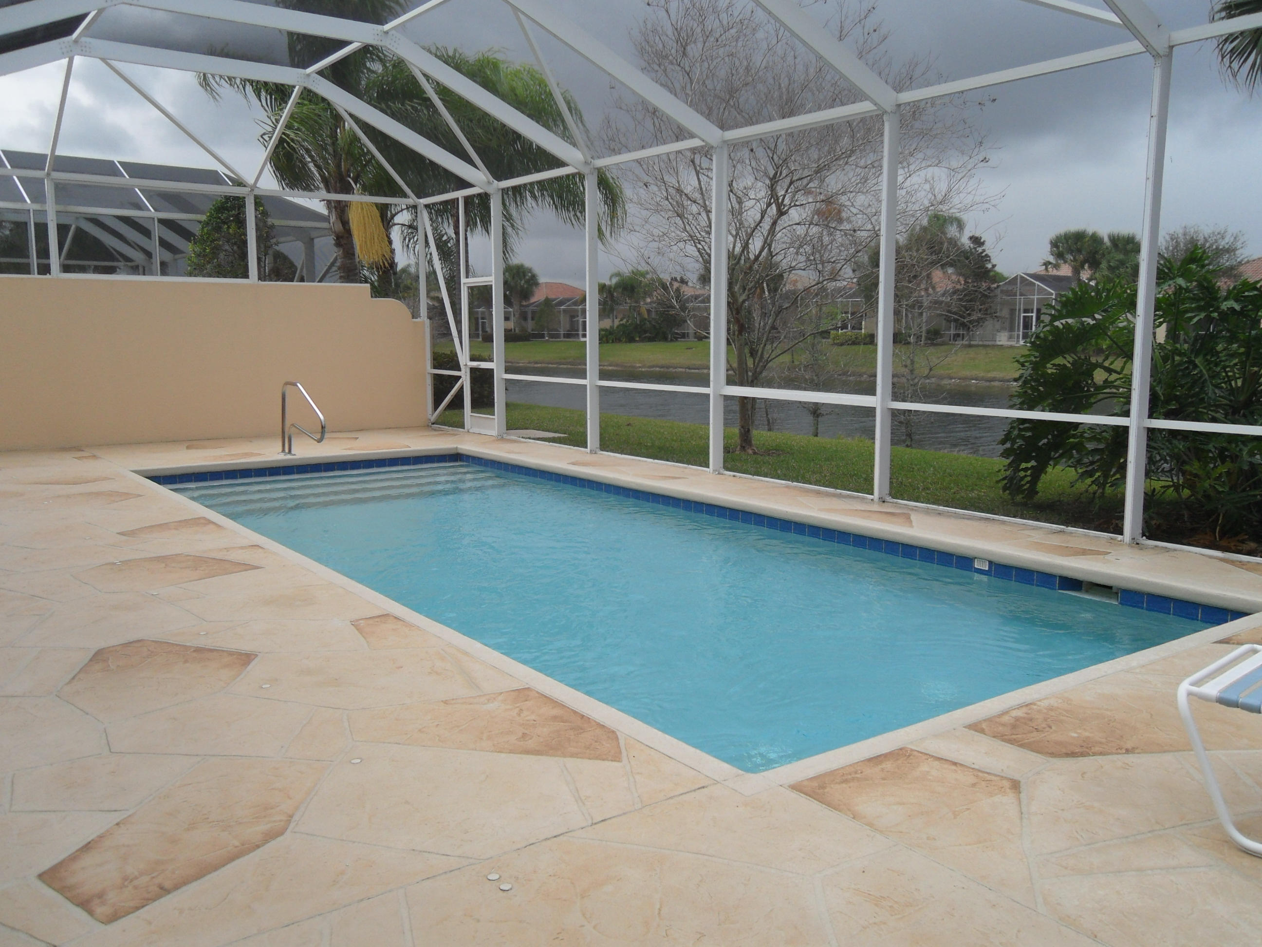 8466 Yorke Road Wellington, FL 33414 - Photo 18 of 36 Heated Screened Pool