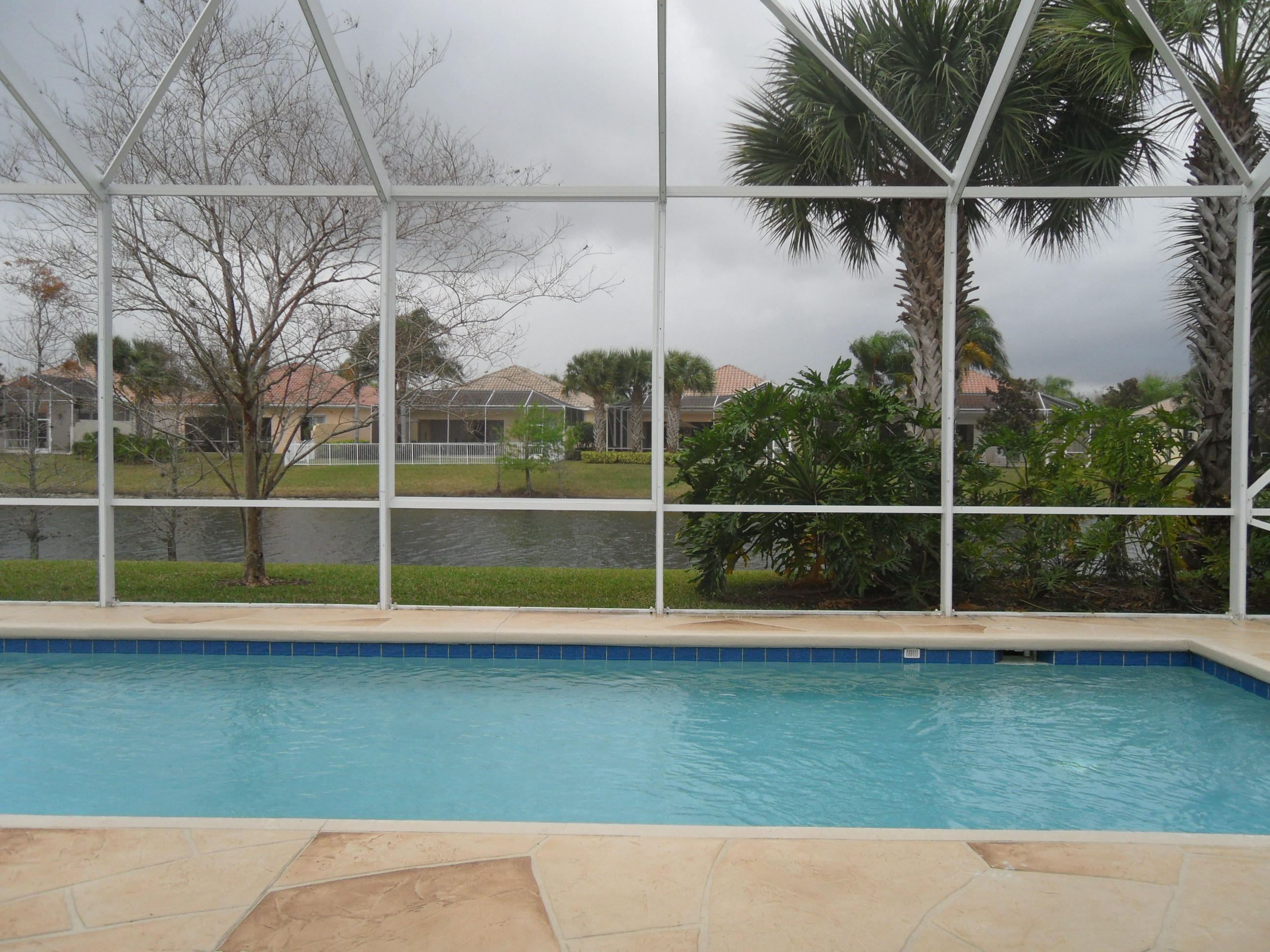 8466 Yorke Road Wellington, FL 33414 - Photo 19 of 36 Heated Screened Pool