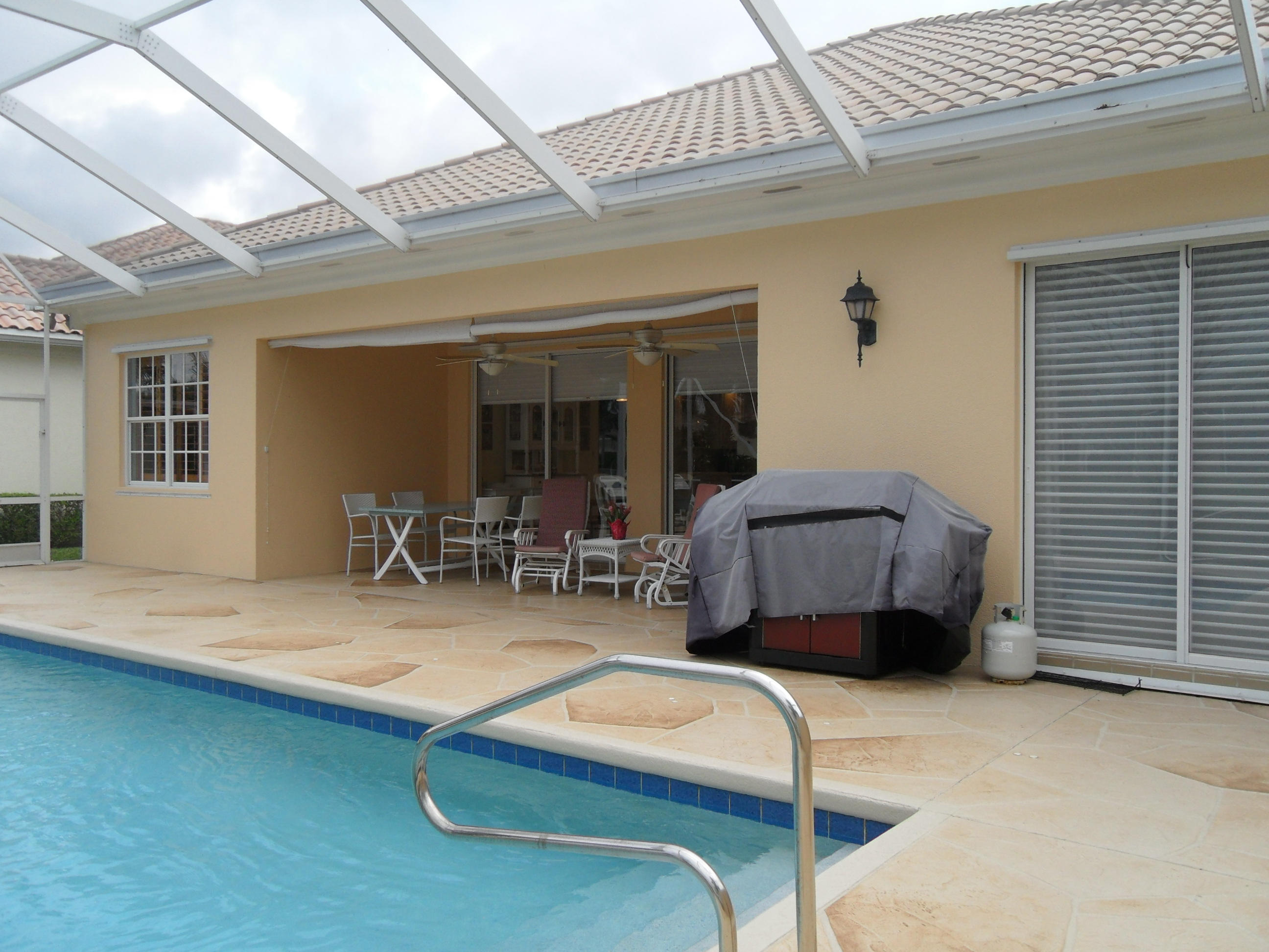 8466 Yorke Road Wellington, FL 33414 - Photo 21 of 36 Covered Screened Patio