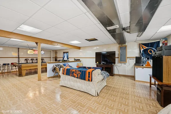 a living room with furniture and flat screen tv