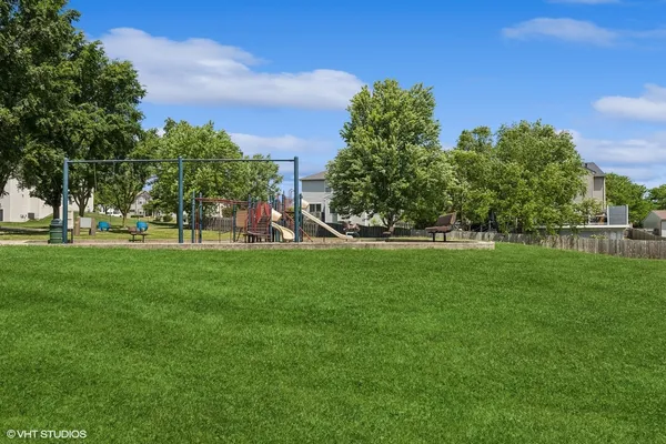 a view of a park with large trees