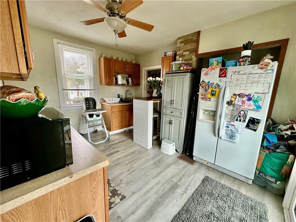 625 Delaware Street Monessen, PA 15062 - Photo 11 of 15 a view of a kitchen with fridge and workspace