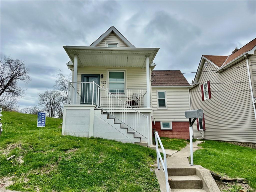 625 Delaware Street Monessen, PA 15062 - Photo 2 of 15 a front view of a house with garden
