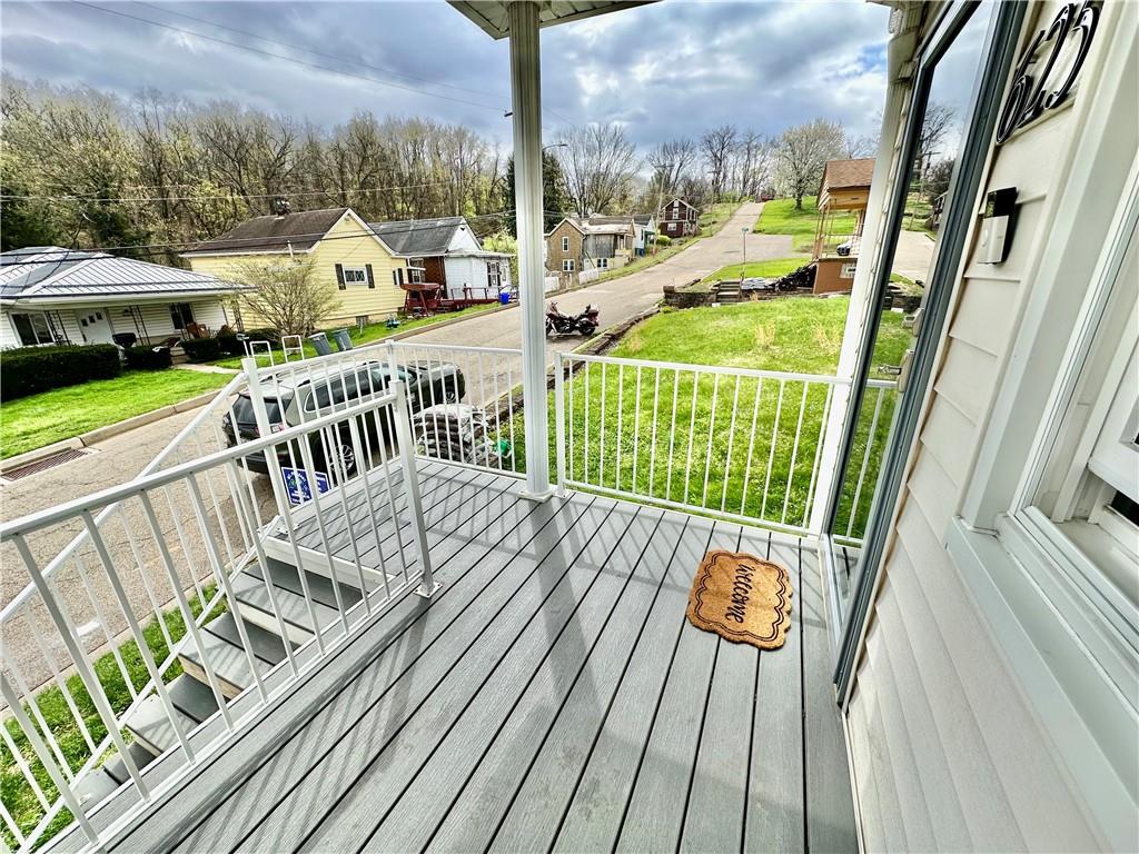 625 Delaware Street Monessen, PA 15062 - Photo 4 of 15 a view of balcony with wooden floor and outdoor seating