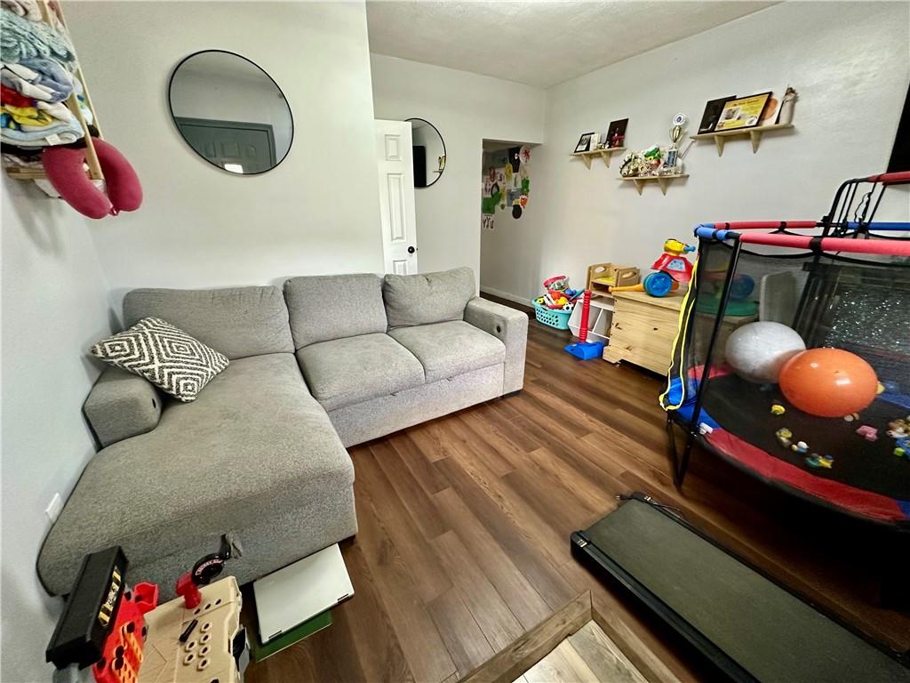 625 Delaware Street Monessen, PA 15062 - Photo 5 of 15 a living room with furniture and a rug