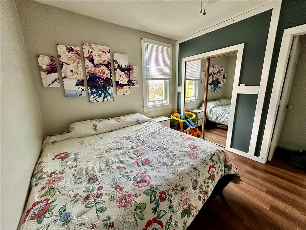 625 Delaware Street Monessen, PA 15062 - Photo 8 of 15 a bedroom with a bed and a painting on the wall