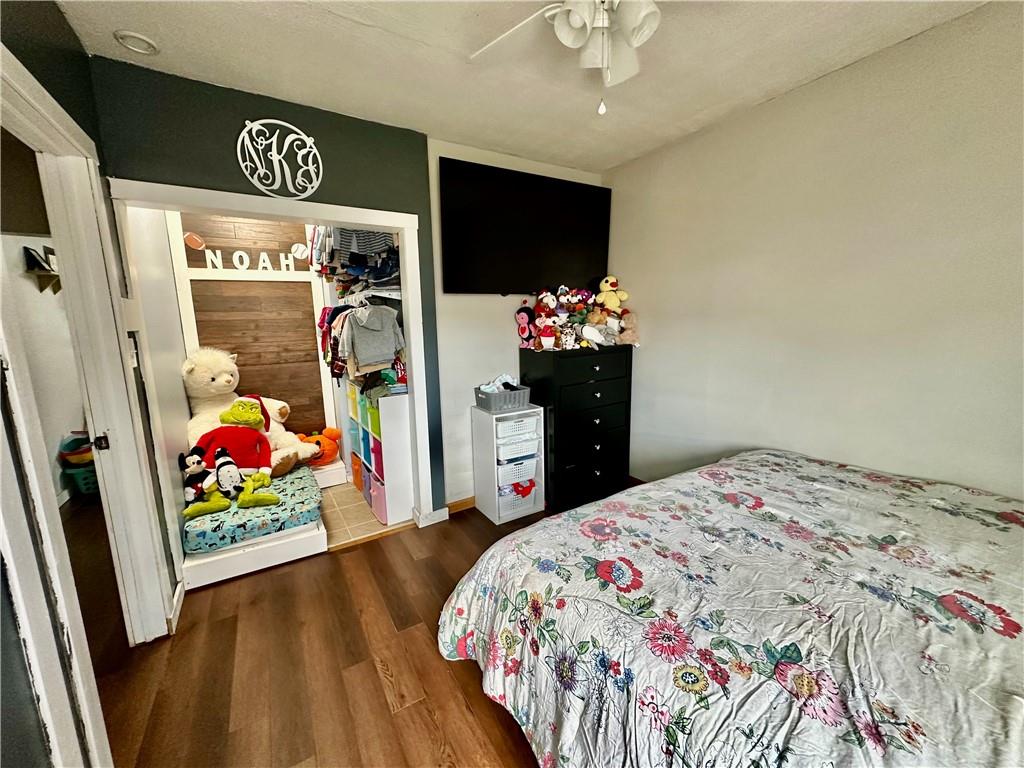 625 Delaware Street Monessen, PA 15062 - Photo 10 of 15 a bedroom with a bed and a dresser