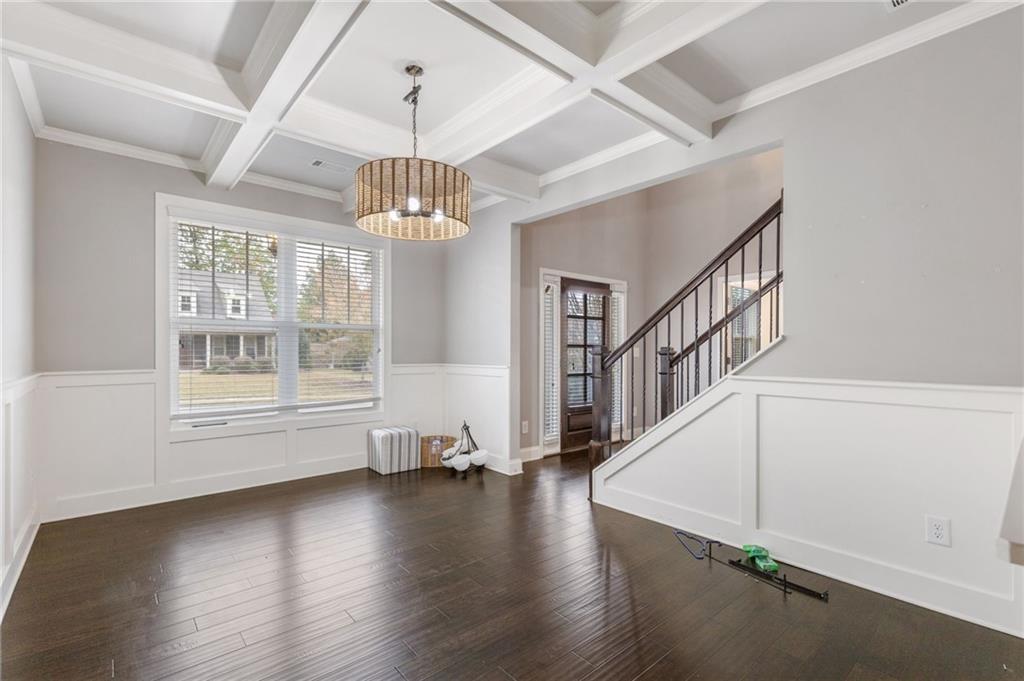 1023 Ruddy Duck Drive Jefferson, GA 30549 - Photo 11 of 69 an empty room with wooden floor chandelier and windows