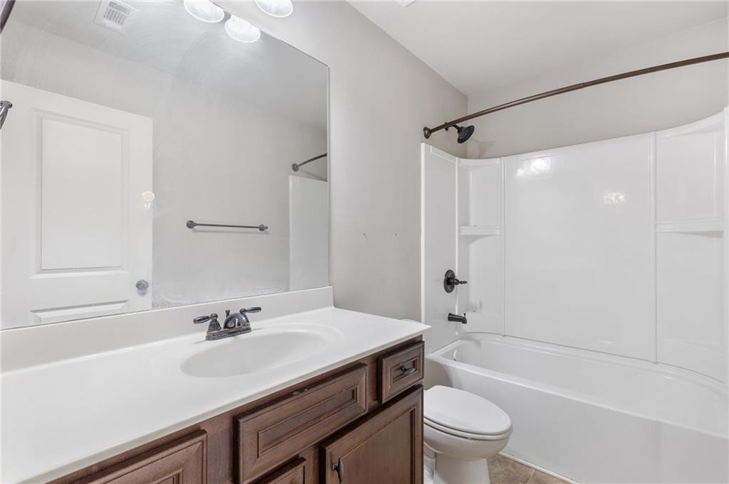 1023 Ruddy Duck Drive Jefferson, GA 30549 - Photo 33 of 69 a bathroom with a sink a toilet and shower