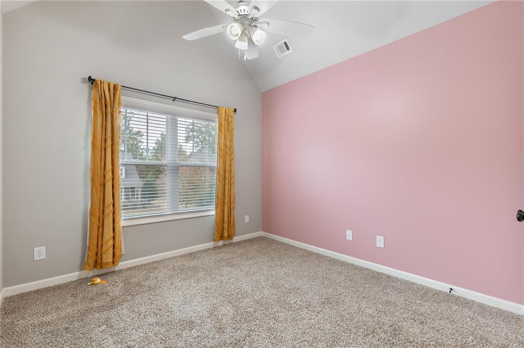 1023 Ruddy Duck Drive Jefferson, GA 30549 - Photo 35 of 69 an empty room with chandelier fan and windows