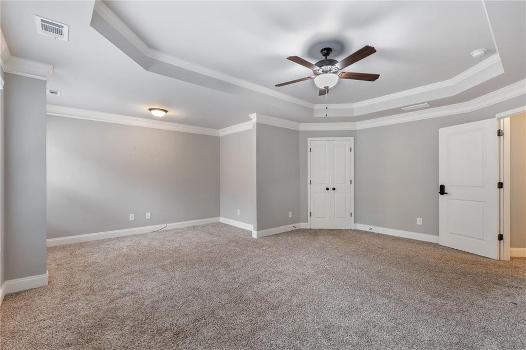 1023 Ruddy Duck Drive Jefferson, GA 30549 - Photo 37 of 69 a view of an empty room with a ceiling fan
