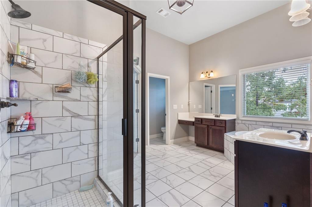 1023 Ruddy Duck Drive Jefferson, GA 30549 - Photo 41 of 69 a large bathroom with a tub sink shower and mirror