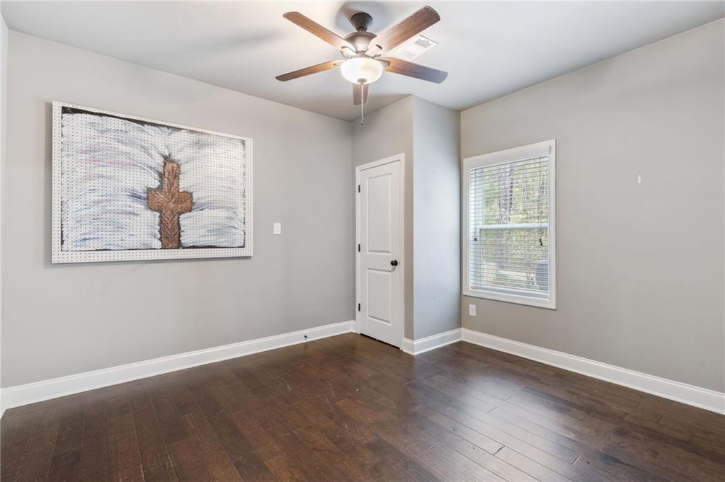 1023 Ruddy Duck Drive Jefferson, GA 30549 - Photo 51 of 69 a view of an empty room with a window and a painting on the wall