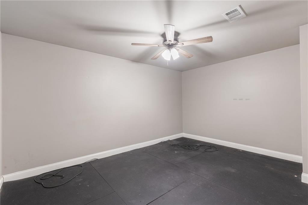 1023 Ruddy Duck Drive Jefferson, GA 30549 - Photo 55 of 69 an empty room with a window and a fan