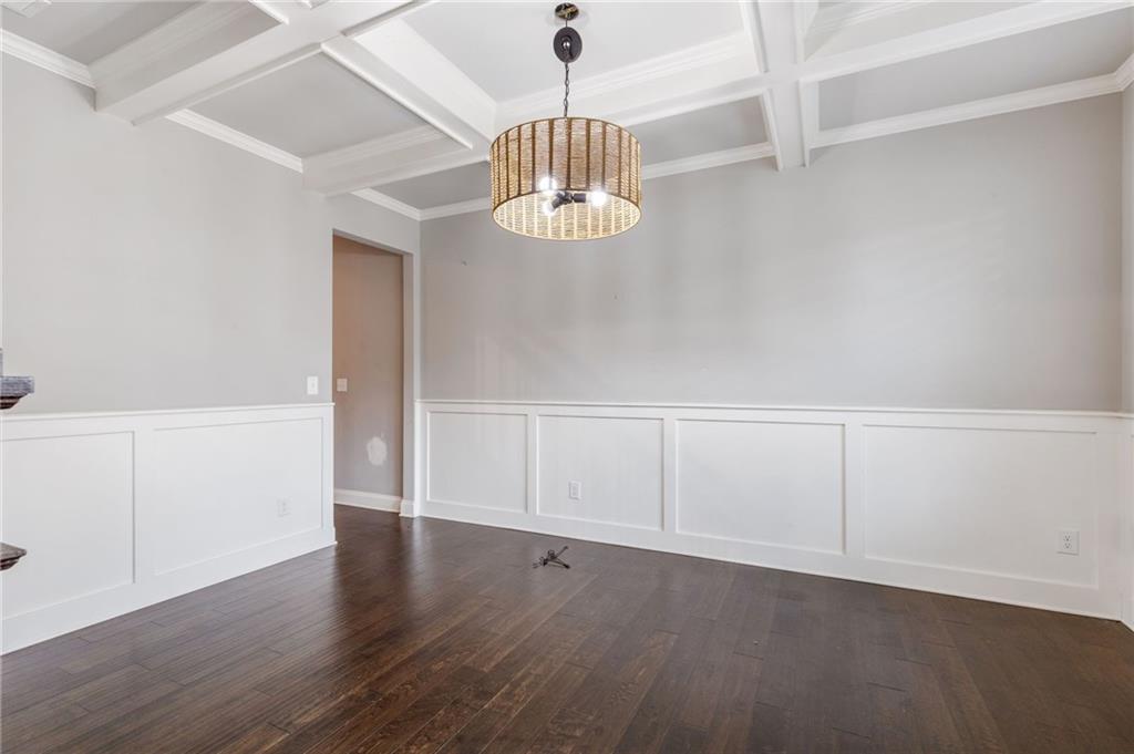 1023 Ruddy Duck Drive Jefferson, GA 30549 - Photo 10 of 69 a view of an empty room with chandelier fan and wooden floor