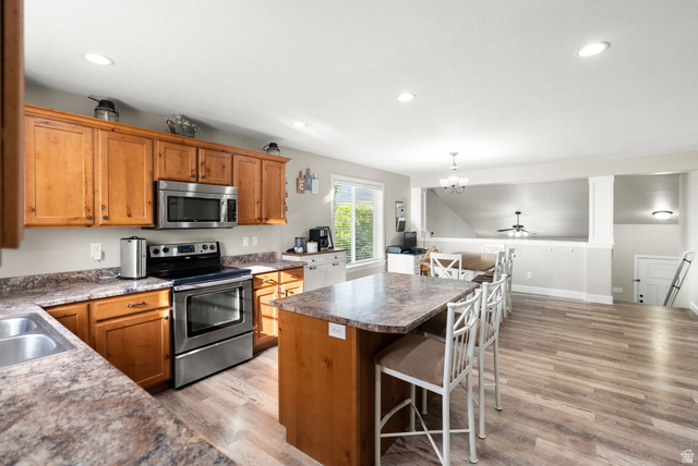 2485 South 1100th Street West Logan, UT 84321 - Photo 15 of 53 Kitchen featuring wood cabinetry, stainless steel appliances, and a double basin sink