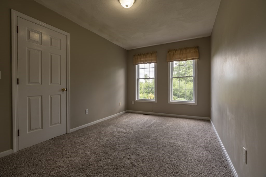 31 Hickory Lane Hudson, MA 01749 - Photo 12 of 40 an empty room with windows and closet