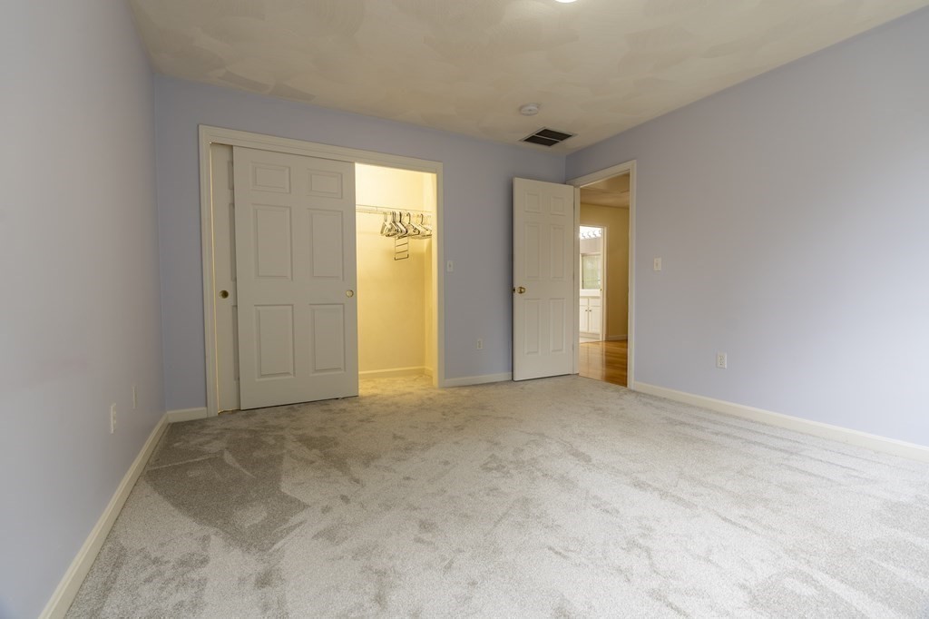31 Hickory Lane Hudson, MA 01749 - Photo 18 of 40 a view of an empty room with closet and a window