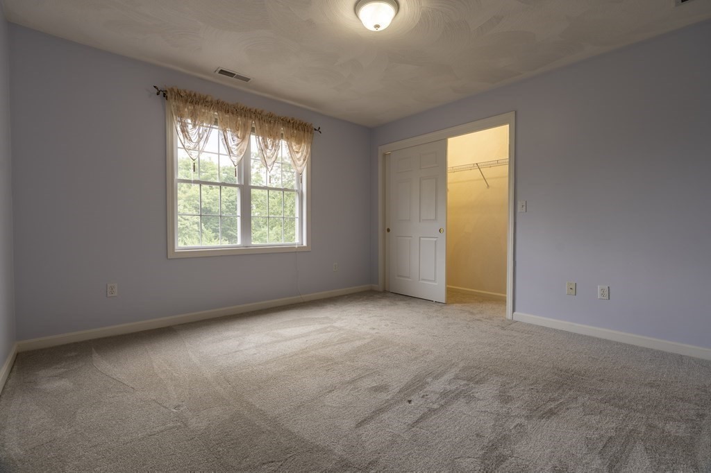 31 Hickory Lane Hudson, MA 01749 - Photo 19 of 40 an empty room with a window
