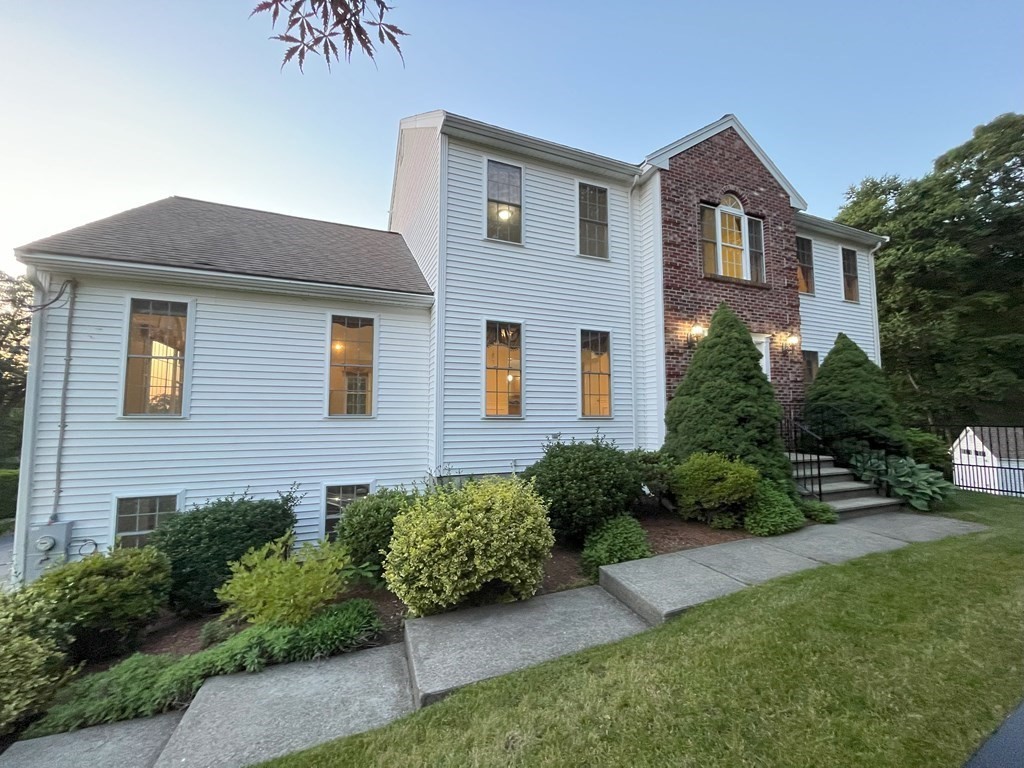 31 Hickory Lane Hudson, MA 01749 - Photo 2 of 40 a front view of a house with garden