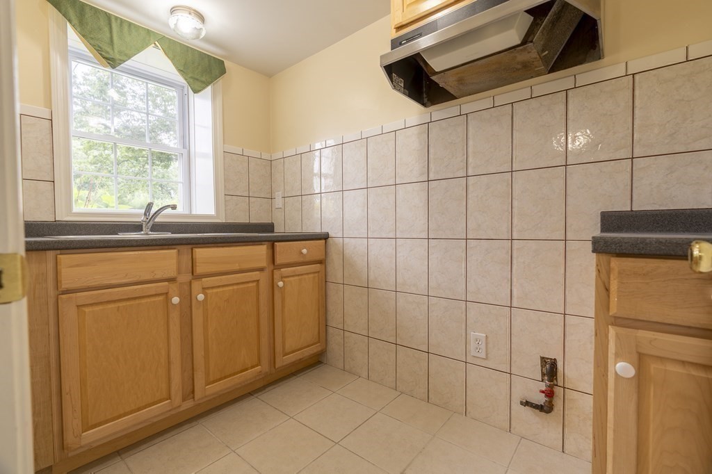 31 Hickory Lane Hudson, MA 01749 - Photo 22 of 40 a bathroom with a sink and a shower