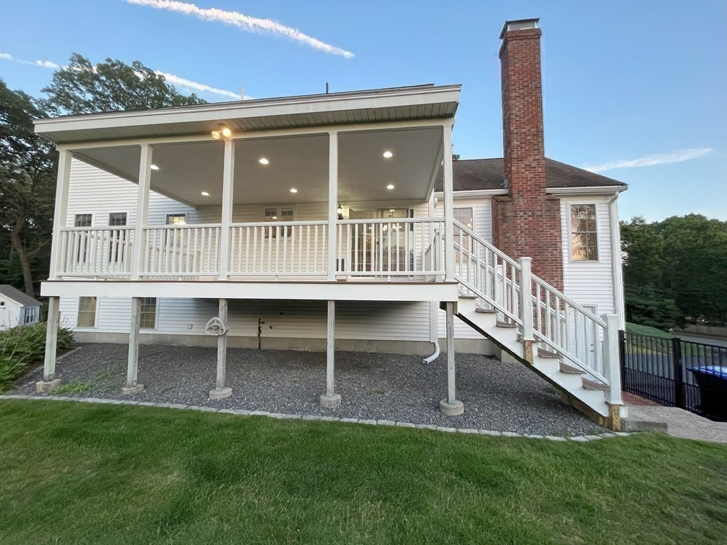 31 Hickory Lane Hudson, MA 01749 - Photo 30 of 40 a view of a house with a deck and a yard