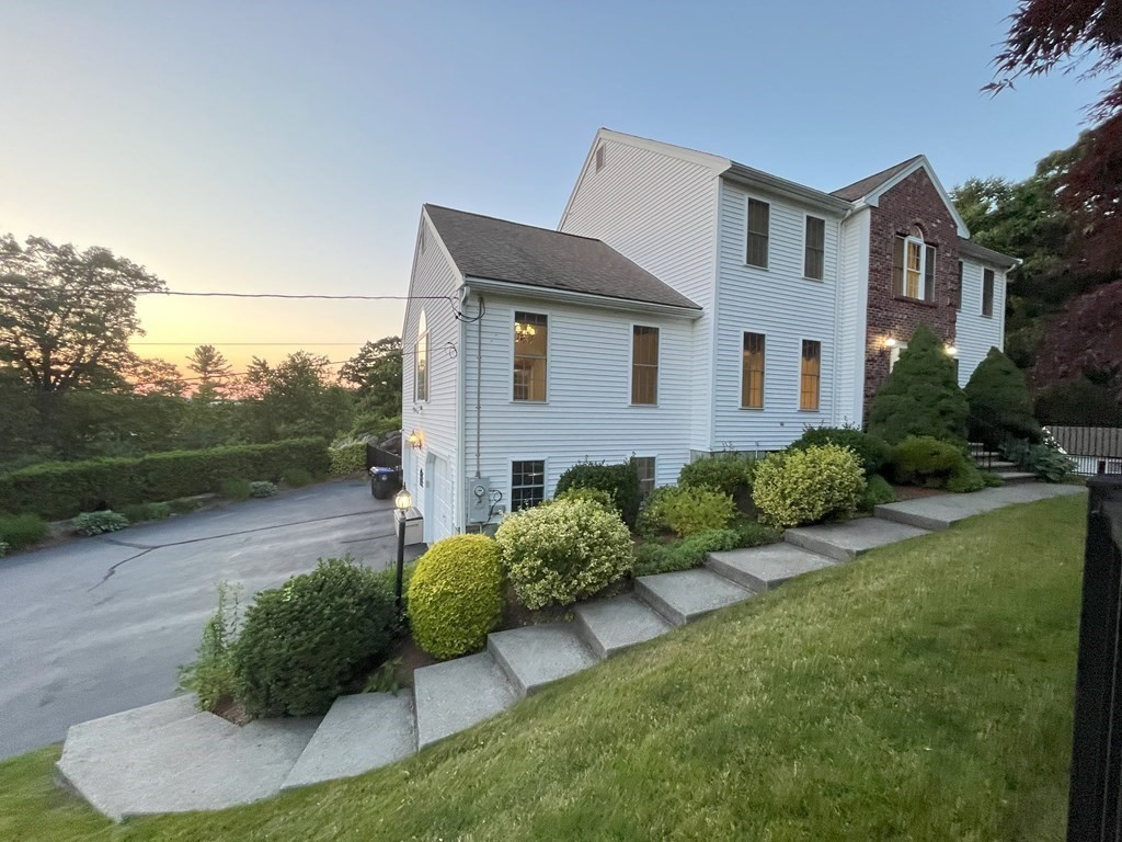 31 Hickory Lane Hudson, MA 01749 - Photo 3 of 40 a front view of a house with garden