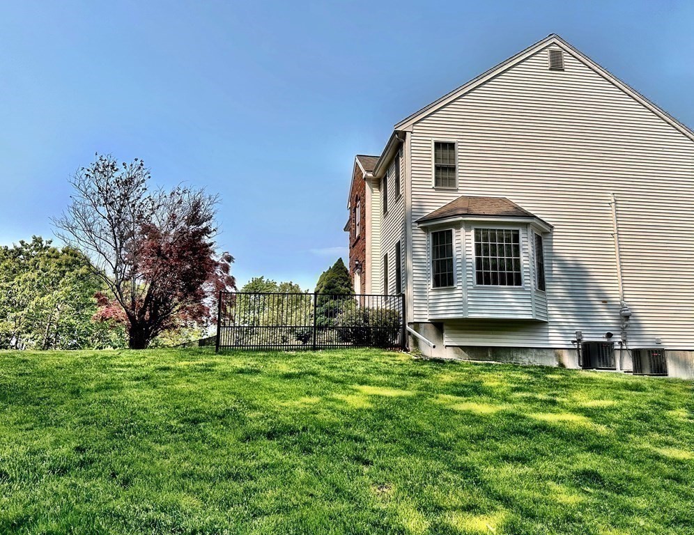 31 Hickory Lane Hudson, MA 01749 - Photo 33 of 40 a front view of house with yard