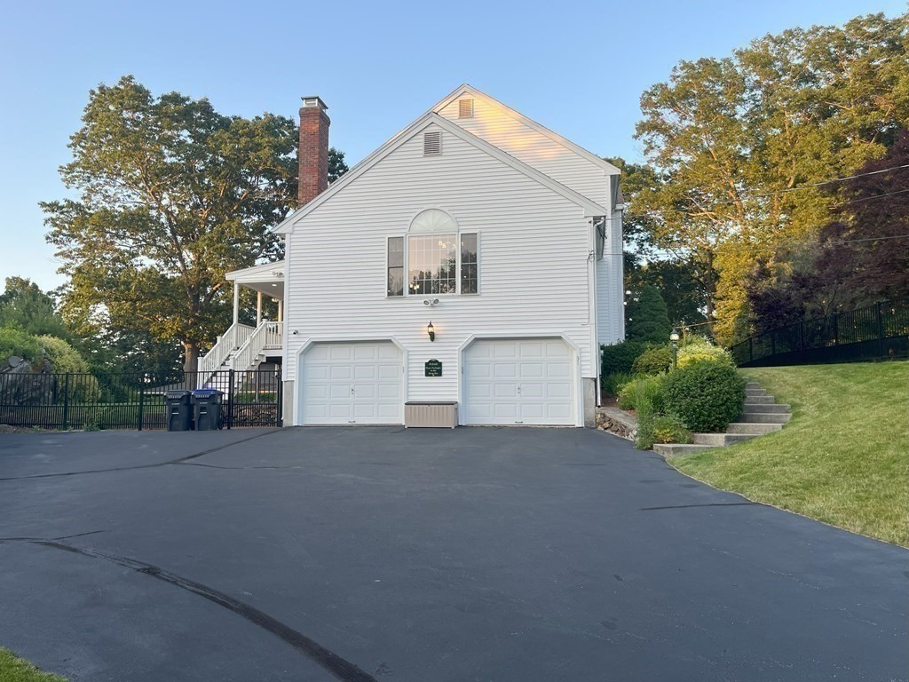 31 Hickory Lane Hudson, MA 01749 - Photo 35 of 40 a view of white house with a yard and large tree