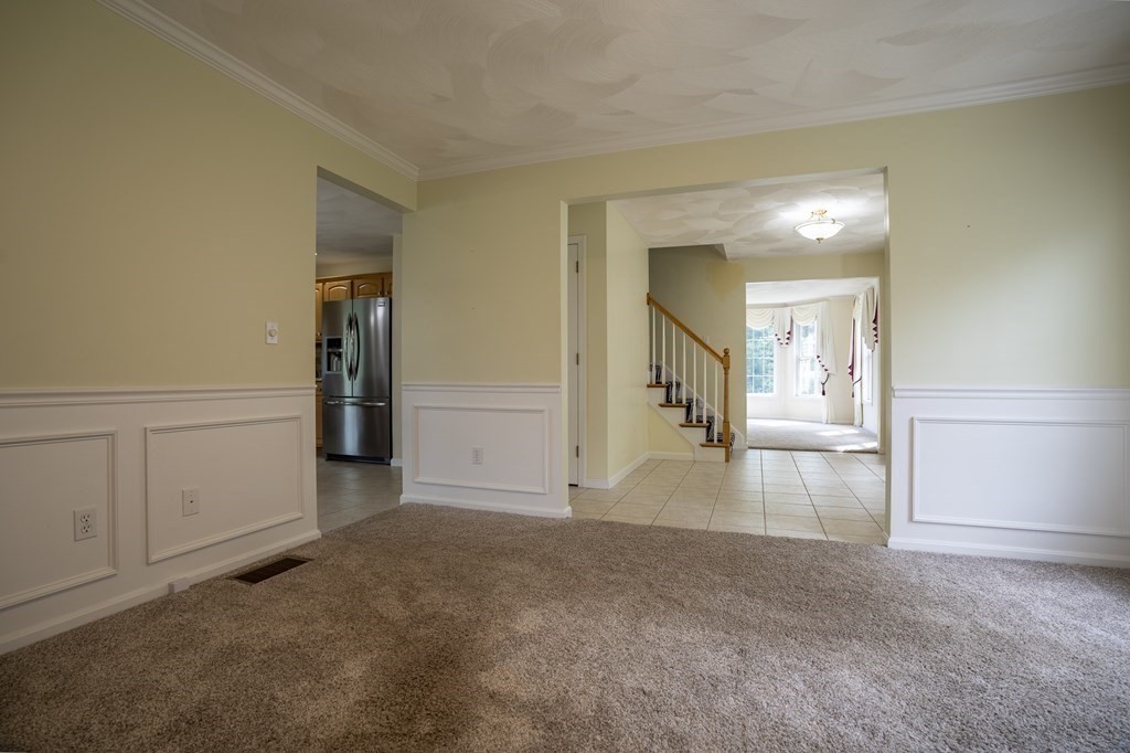 31 Hickory Lane Hudson, MA 01749 - Photo 6 of 40 a view of a livingroom with wooden floor and cabinet