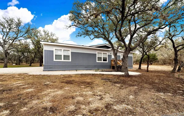 a house with yard in front of it