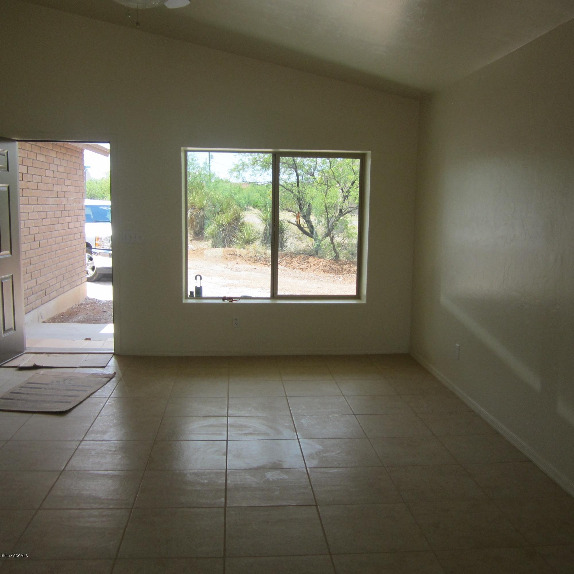 96 Paseo Mexico Rio Rico, AZ 85648 - Photo 6 of 15 a view of an empty room with a window