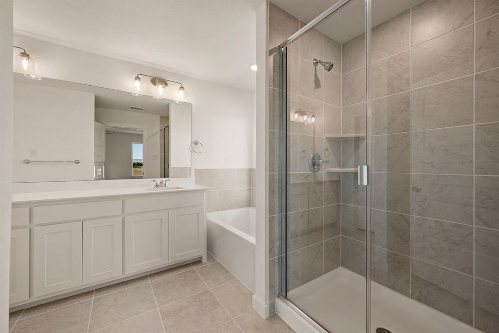 1016 Gatlin Circle Springtown, TX 76082 - Photo 20 of 30 a bathroom with a double vanity sink mirror and shower