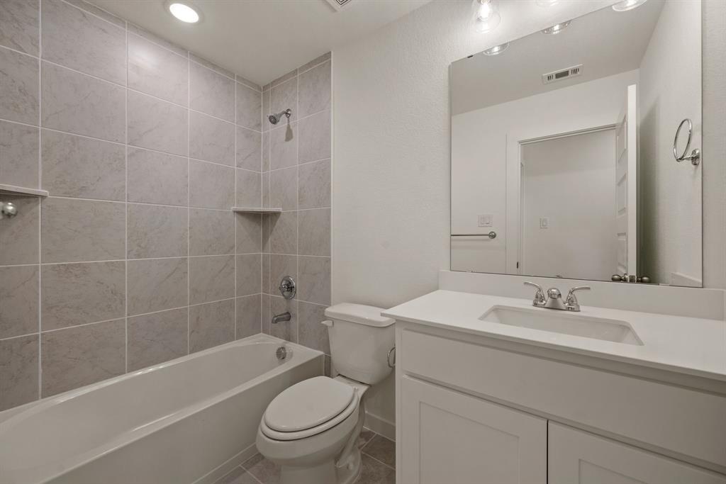 1016 Gatlin Circle Springtown, TX 76082 - Photo 24 of 30 a bathroom with a sink a toilet and shower