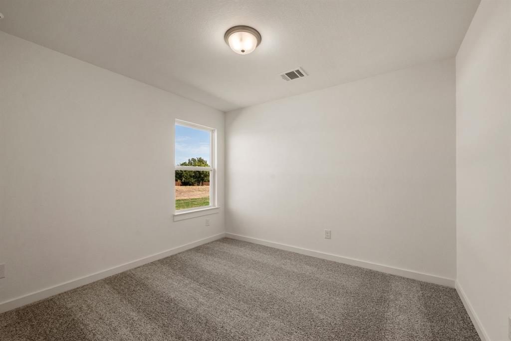 1016 Gatlin Circle Springtown, TX 76082 - Photo 25 of 30 wooden floor and window in a room