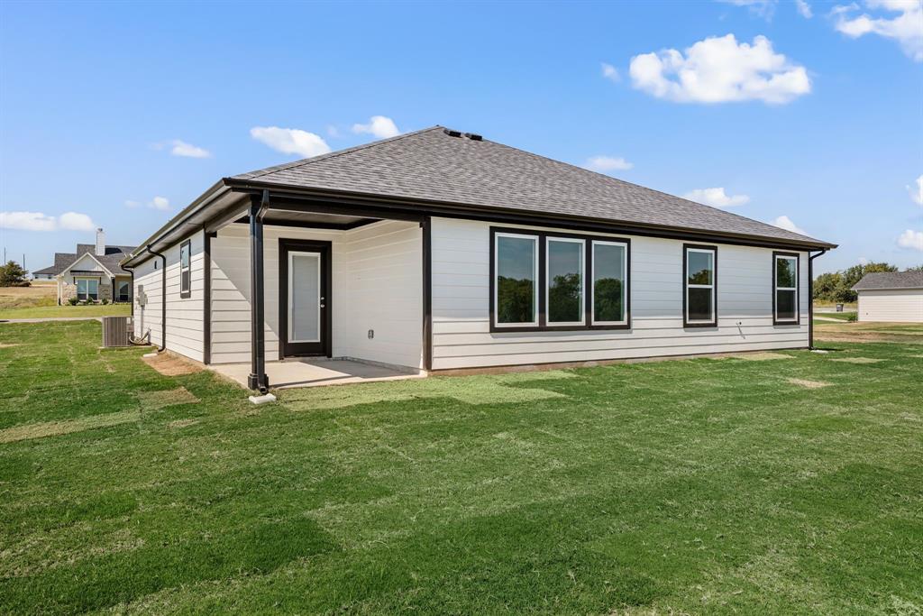 1016 Gatlin Circle Springtown, TX 76082 - Photo 28 of 30 a house view with a garden space