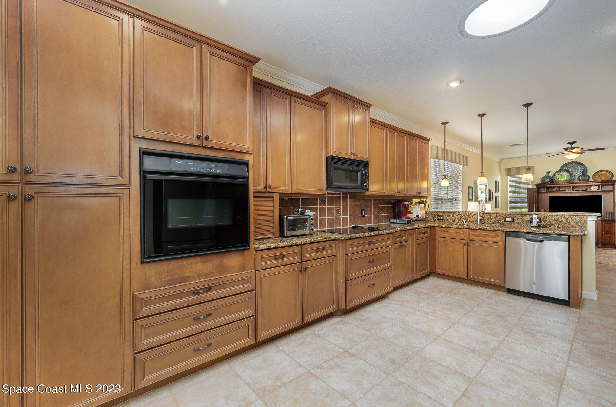 6972 Premonition Drive Melbourne, FL 32940 - Photo 11 of 33 a kitchen with a sink stove and oven